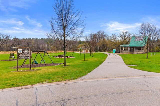 surrounding community with a lawn