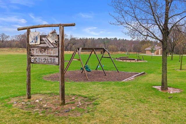 community jungle gym featuring a yard
