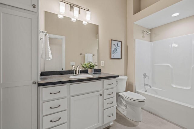 full bathroom featuring vanity, tub / shower combination, tile patterned floors, and toilet