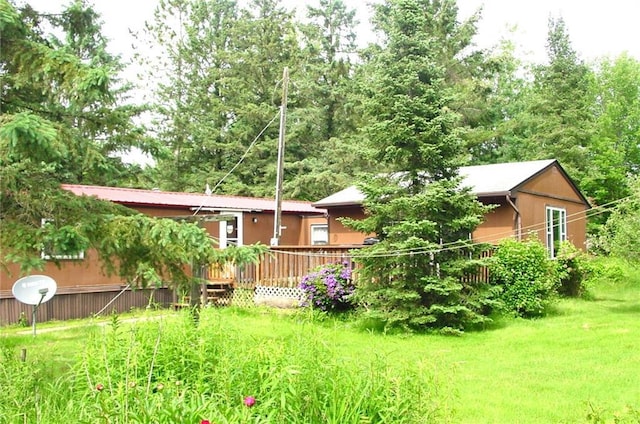 N5984 Thomas St, Ingram, WI 54526 - back of house featuring a lawn and a wooden deck