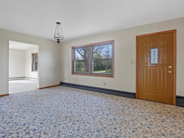 unfurnished room with baseboards and baseboard heating