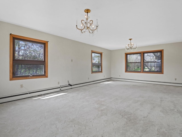 empty room featuring an inviting chandelier, baseboards, and carpet