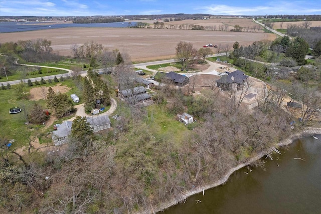 birds eye view of property featuring a water view and a rural view