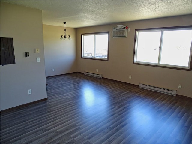 unfurnished room featuring a textured ceiling, dark wood-type flooring, and a baseboard radiator