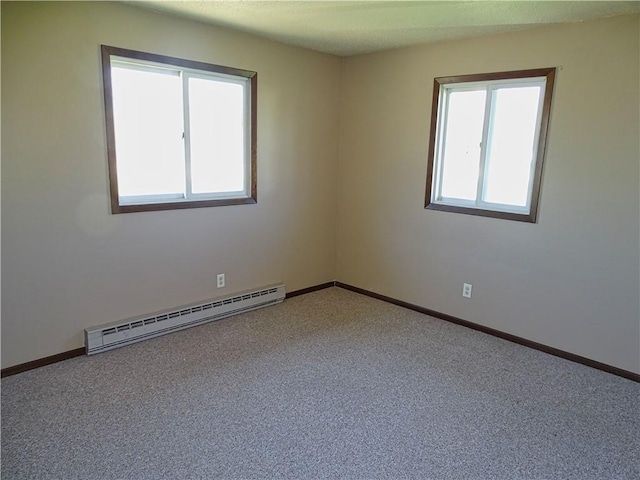unfurnished room featuring baseboards, a baseboard radiator, and carpet flooring