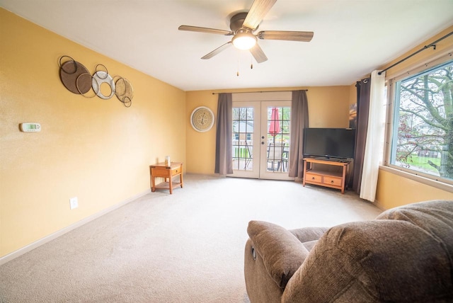 712 Frank St, Darlington, WI 53530 - living area featuring carpet, a wealth of natural light, french doors, and a ceiling fan