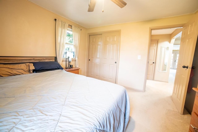 712 Frank St, Darlington, WI 53530 - bedroom with light colored carpet, a closet, and ceiling fan