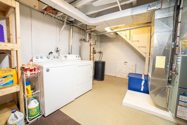 712 Frank St, Darlington, WI 53530 - clothes washing area with laundry area, washer and clothes dryer, and water heater
