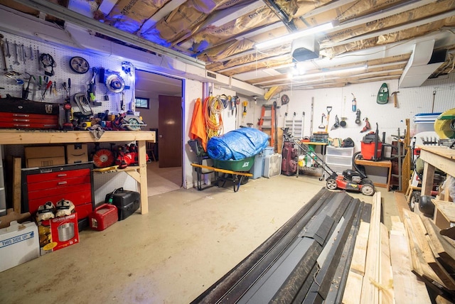 712 Frank St, Darlington, WI 53530 - unfinished below grade area with visible vents and a workshop area