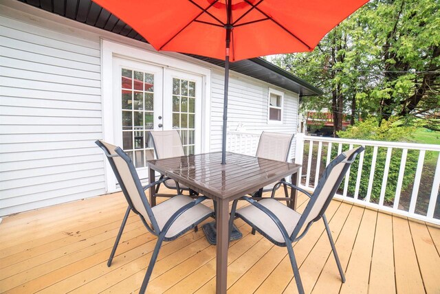 712 Frank St, Darlington, WI 53530 - wooden deck with outdoor dining area and french doors