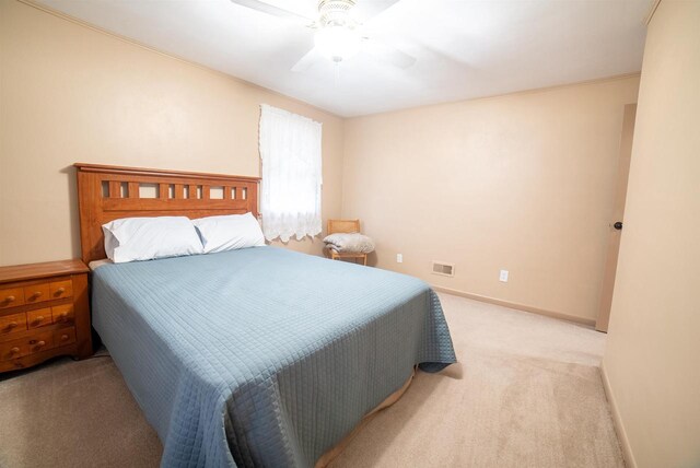712 Frank St, Darlington, WI 53530 - bedroom featuring ceiling fan, light carpet, baseboards, and visible vents