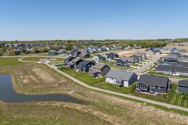 aerial view of residential area with a nearby body of water