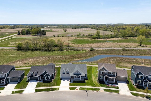 overview of rural landscape featuring a large body of water and nearby suburban area