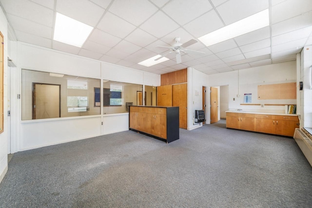 510 Lake St, Cascade, WI 53011 - interior space featuring carpet flooring, a ceiling fan, heating unit, and a paneled ceiling