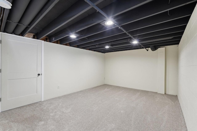 finished basement with carpet flooring