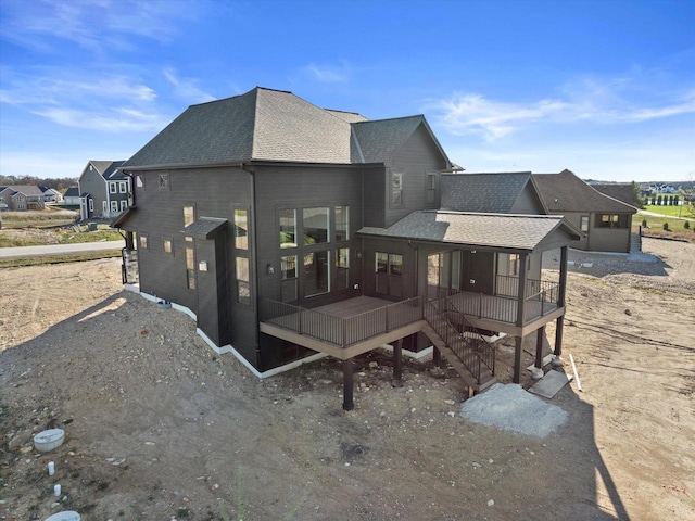 N59W27328 Autumn Ct, Lisbon, WI 53089 - back of house featuring a shingled roof and a wooden deck