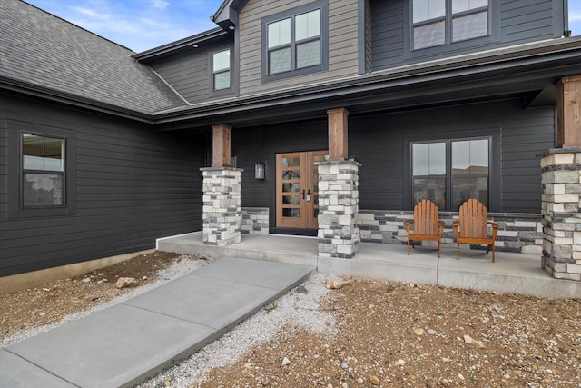 N59W27328 Autumn Ct, Lisbon, WI 53089 - view of exterior entry with covered porch and a shingled roof