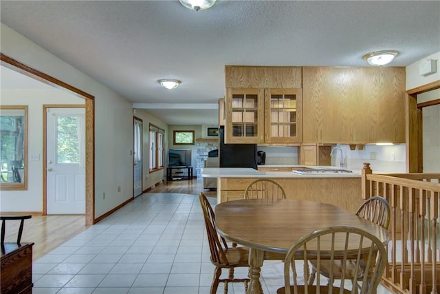 1897 Breezy Bay Rd, Balsam Lake, WI 54810 - dining area featuring a textured ceiling, baseboards, and light tile patterned flooring