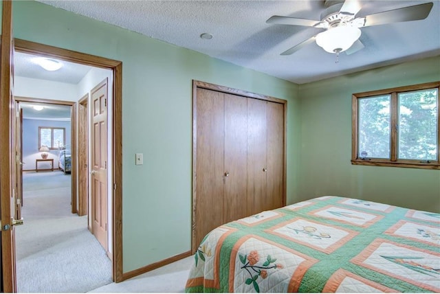 1897 Breezy Bay Rd, Balsam Lake, WI 54810 - bedroom featuring a ceiling fan, a textured ceiling, carpet, and a closet