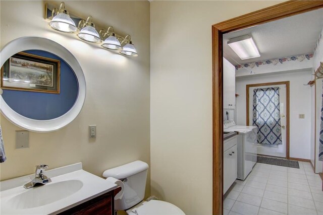 1897 Breezy Bay Rd, Balsam Lake, WI 54810 - bathroom featuring washer / clothes dryer, toilet, tile patterned flooring, and vanity
