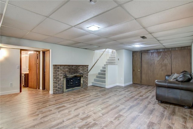 1897 Breezy Bay Rd, Balsam Lake, WI 54810 - living room with stairway, baseboards, a drop ceiling, and wood finished floors