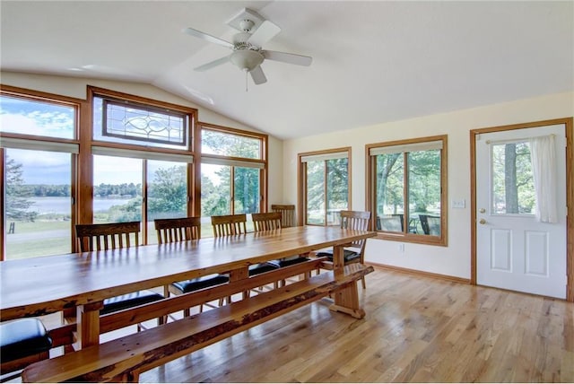 1897 Breezy Bay Rd, Balsam Lake, WI 54810 - dining room featuring baseboards, ceiling fan, lofted ceiling, and a wealth of natural light