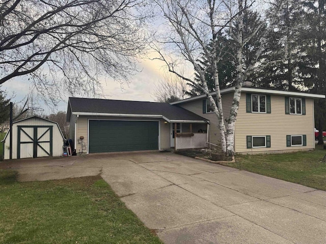 266 Forest St, Berlin, WI 54926 - tri-level home with an attached garage, a lawn, driveway, and a storage unit