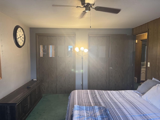 266 Forest St, Berlin, WI 54926 - carpeted bedroom with wooden walls and a ceiling fan