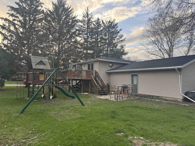266 Forest St, Berlin, WI 54926 - back of property featuring a lawn, a deck, and a playground