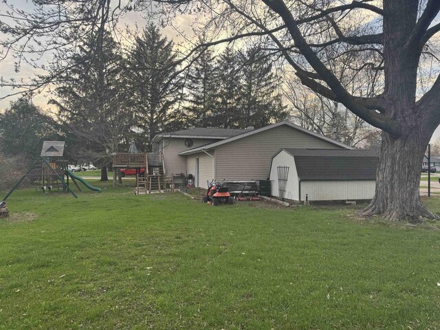 266 Forest St, Berlin, WI 54926 - exterior space featuring a storage unit, an outbuilding, a playground, and a yard