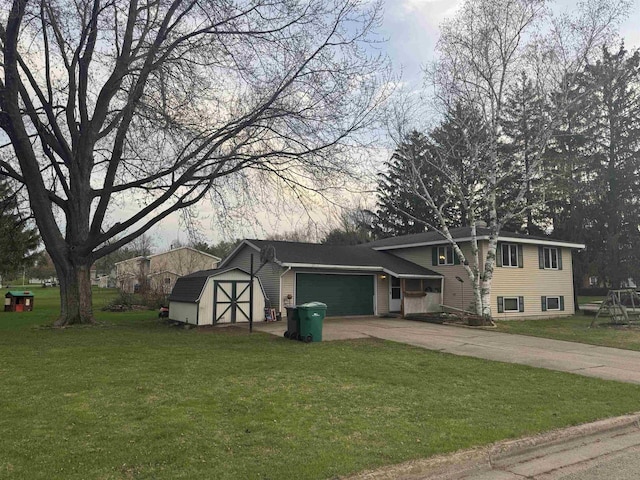 266 Forest St, Berlin, WI 54926 - split level home with concrete driveway, an attached garage, a front yard, and a storage unit