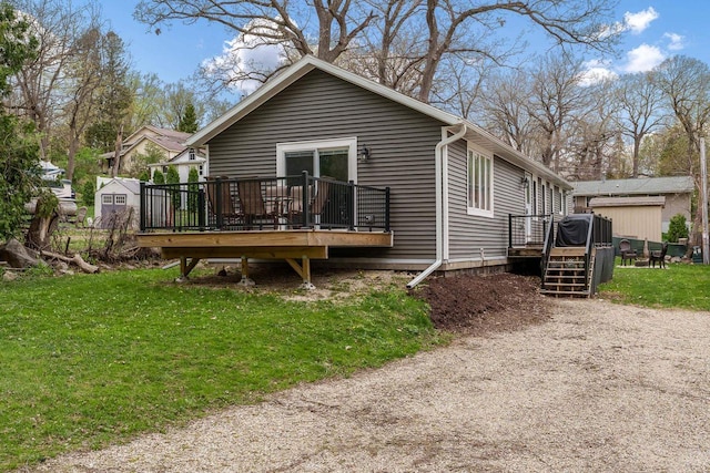 1729 E Rd 5, Milton, WI 53534 - back of property with an outdoor structure, a yard, a storage shed, and a deck