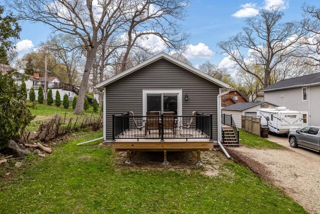 1729 E Rd 5, Milton, WI 53534 - back of property featuring a wooden deck and a yard