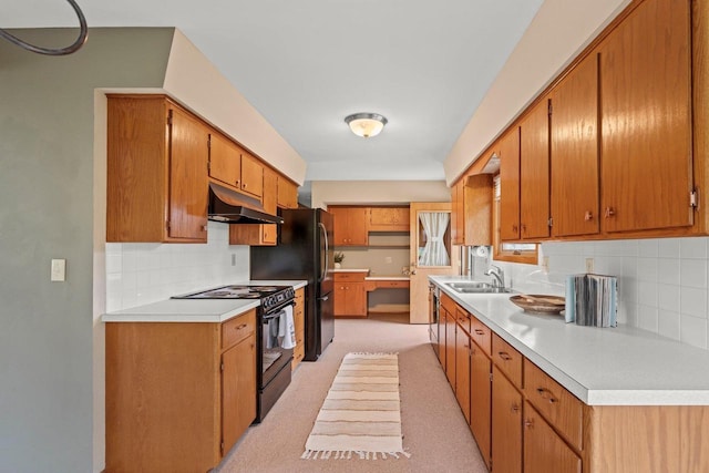 kitchen with black electric range oven, a sink, tasteful backsplash, under cabinet range hood, and light carpet