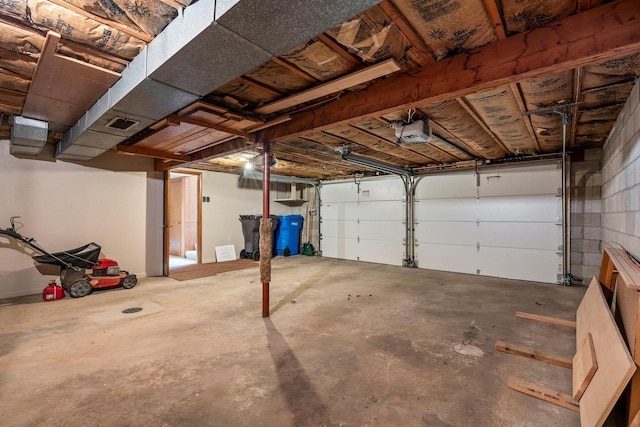 garage with visible vents and a garage door opener