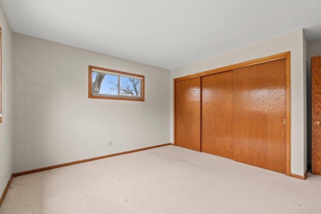 unfurnished bedroom with carpet and baseboards