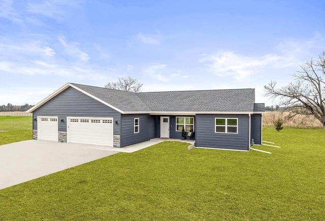 ranch-style home with an attached garage, driveway, and a front yard