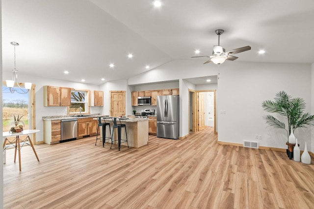 kitchen with a kitchen island, stainless steel appliances, visible vents, and recessed lighting