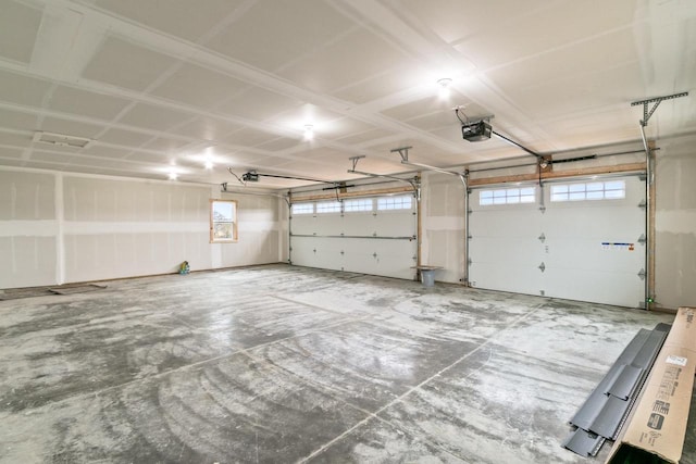 garage featuring a garage door opener
