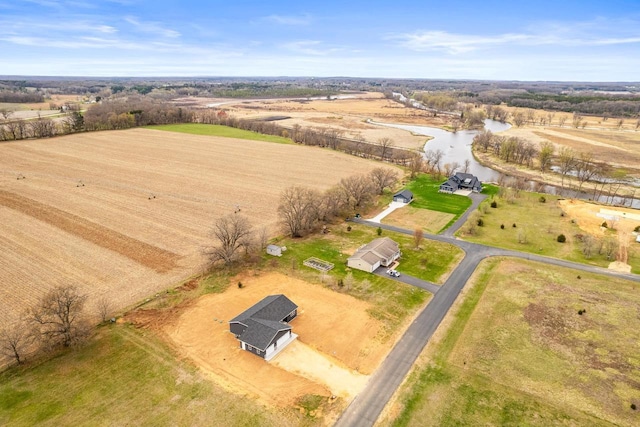 drone / aerial view featuring a water view and a rural view