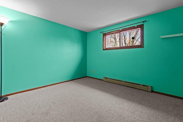 spare room featuring baseboards, a baseboard radiator, and carpet