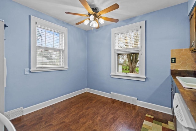 unfurnished dining area featuring a ceiling fan, visible vents, and a healthy amount of sunlight