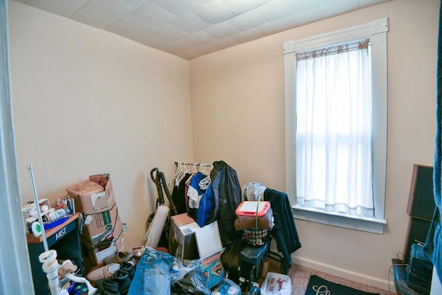 interior space featuring carpet floors and baseboards