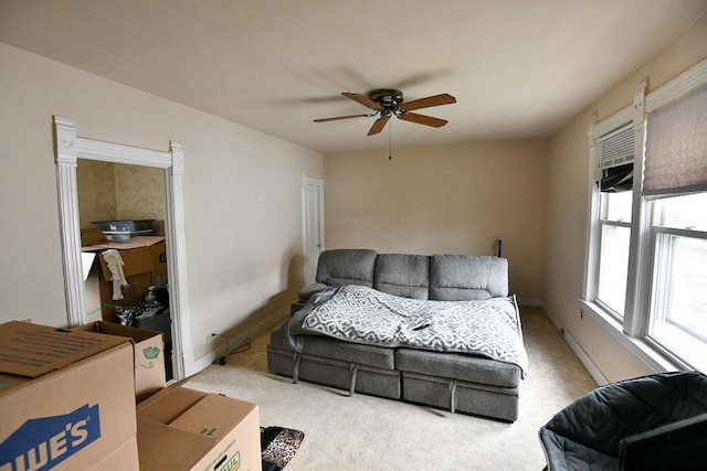 living room featuring a ceiling fan and carpet flooring