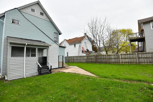 view of yard with entry steps and fence