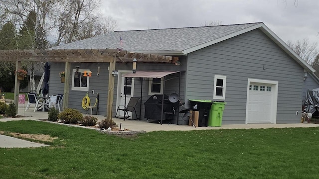 556 Gold St, Green Lake, WI 54941 - back of house with roof with shingles, a pergola, a yard, and a patio area