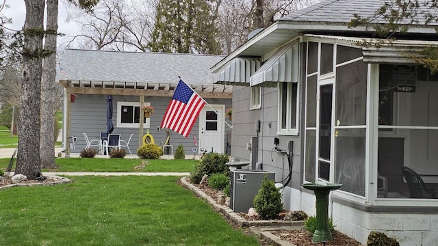 556 Gold St, Green Lake, WI 54941 - view of green lawn featuring a sunroom