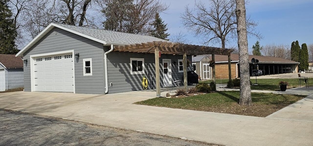 556 Gold St, Green Lake, WI 54941 - single story home with a pergola, driveway, an attached garage, and roof with shingles