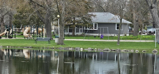 556 Gold St, Green Lake, WI 54941 - back of property featuring a water view and a yard