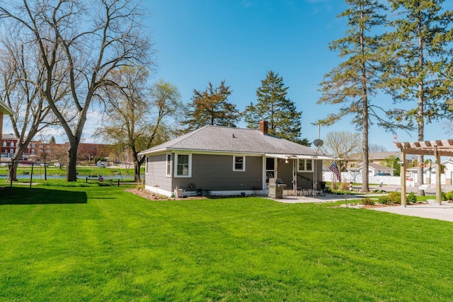 556 Gold St, Green Lake, WI 54941 - back of house with a chimney and a patio